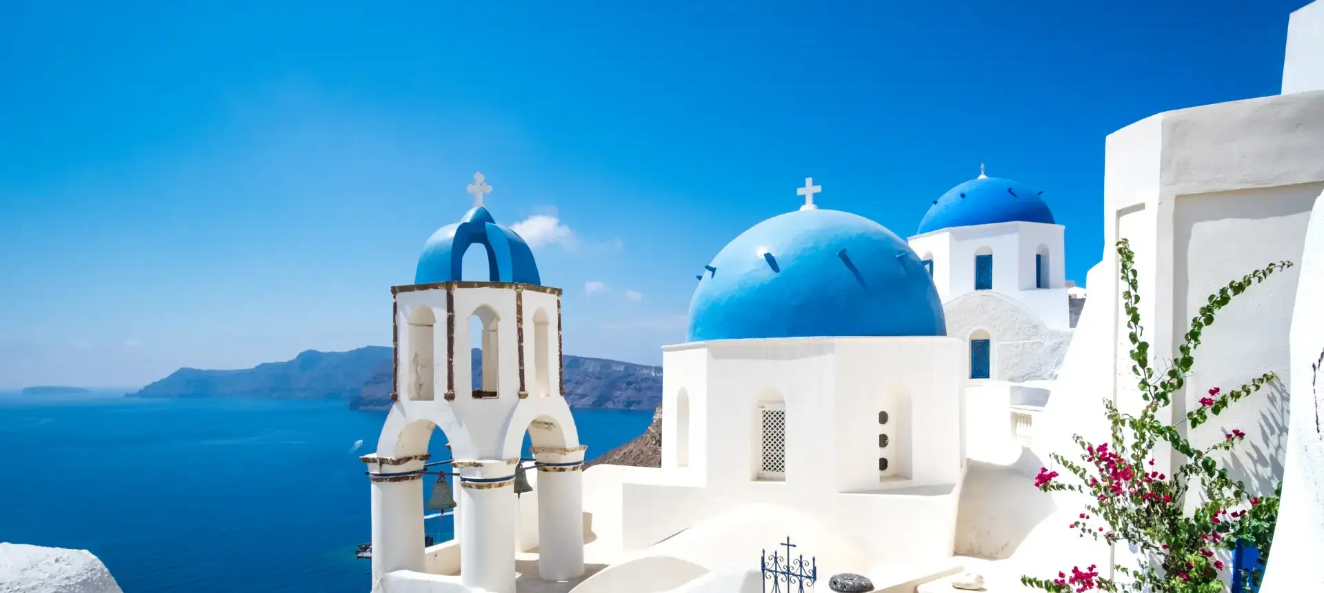 Blue domed church beside the sea, from the existing homepage carousel